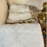 A Bed spread together with a quilt and linen