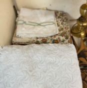 A Bed spread together with a quilt and linen