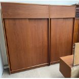 An Austin Suite teak bedroom suite comprising two wardrobes and a dressing table