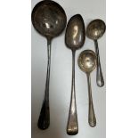 A silver serving spoon together with electroplated ladles etc