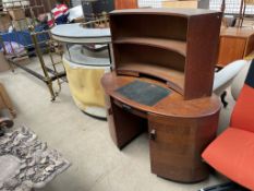 A mid 20th century oak desk of oval form together with a 1950's/60's bar