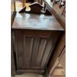 A 20th century mahogany standing corner cupboard with a glazed top and bottom,