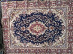 A modern blue ground rug, together with a green ground rug,