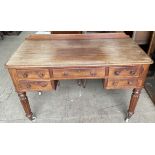 A Victorian mahogany side table with a rectangular top above five drawers on reeded tapering legs