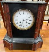 A black slate mantle clock,