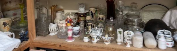 An extensive lot, including a military helmet, crested wares, glasswares, decanters, steins,