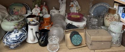 Staffordshire figures together with a parian figure group, lamp shades, tins,