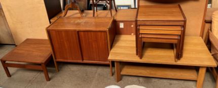 A teak nest of three tables together with a teak side cabinet designed by B Fridhagen for Bodafors,