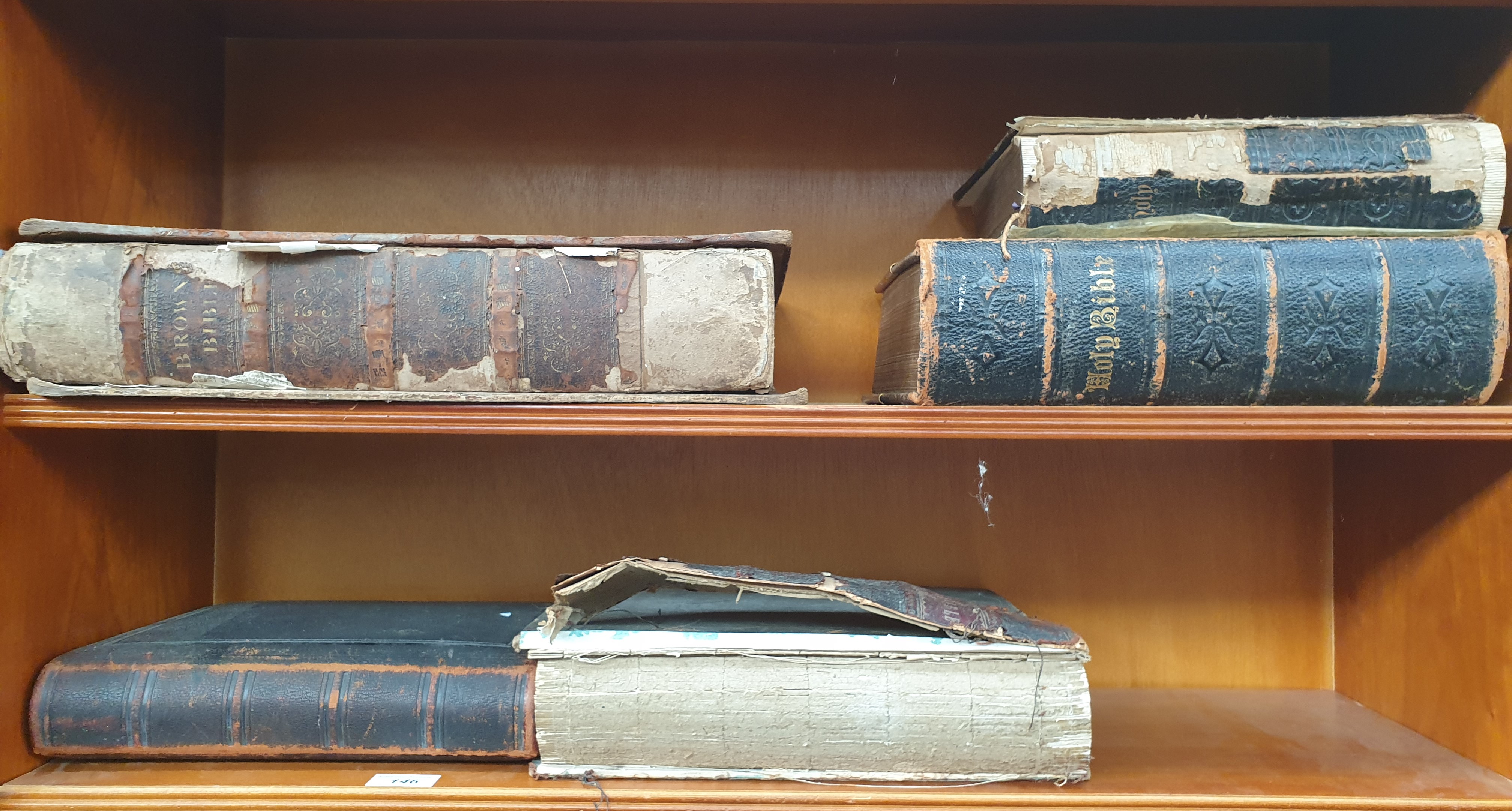 Four Bibles together with a leather covered photograph album