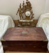 A gilt spelter clock with a soldier holding a flag,