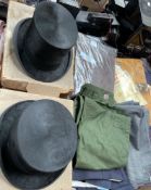 Two top hats together with clothes and materials