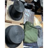Two top hats together with clothes and materials