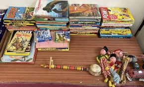 A collection of Children's annuals together with puppets,