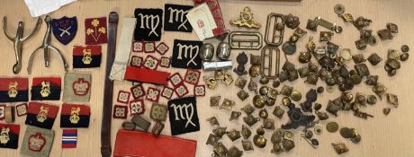 Assorted military cap badges, buttons,