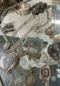 Assorted silver jewellery including a locket, pendants,