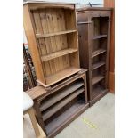 A tall pine bookcase together with two other pine bookcases