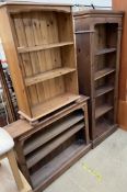 A tall pine bookcase together with two other pine bookcases