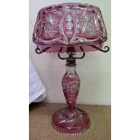 A flash glass table lamp with glass shade and glass baluster column ad spreading foot