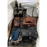 A Polaroid automatic 230 Land camera, together with other cameras, opera glasses,