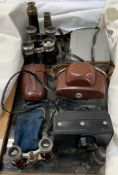 A Polaroid automatic 230 Land camera, together with other cameras, opera glasses,