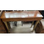 A burr walnut side table on four gilt decorated tapering legs,