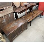 A teak coffee table with ebonised legs together with two wine tables a walking stick and an oak