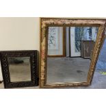 An oak framed wall mirror together with a painted wall mirror