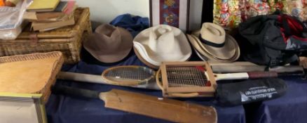 Assorted hats together with cricket bats, hamper,