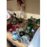 A large glass dumpy weight together with a collection of dumpy weights and other paperweights,