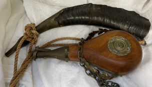 A horn together with a shot flask