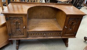 An oak hall chair, with integral table top,