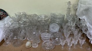 A large quantity of crystal glasswares including Waterford wine glasses, decanters, bowls,