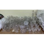 A large quantity of crystal glasswares including Waterford wine glasses, decanters, bowls,