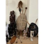 African carved figures, together with shield,