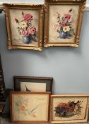 A pair of oil paintings of a vase of flowers together with another oil painting of a vase of