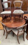 A Victorian mahogany supper table together with a set of six Victorian balloon back dining chairs