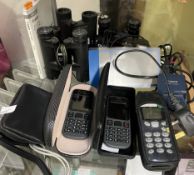 A collection of mobile phones together with a camera,