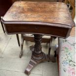 A Victorian walnut work table,