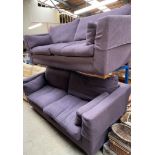 A pair of large purple upholstered settees