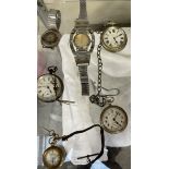 A silver open faced pocket watch together with other pocket and wrist watches