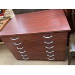 A modern folio chest with six graduated drawers
