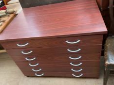 A modern folio chest with six graduated drawers