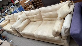 A pair of gold upholstered Knole type settees