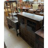 A 20th century oak bookcase together with a dressing chest and an oak occasional table