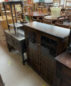 A 20th century oak bookcase together with a dressing chest and an oak occasional table
