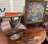 A copper coal scuttle together with fire irons and a woolwork fire screen