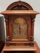 An oak mantle clock,