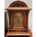 An oak mantle clock,