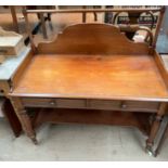 A Victorian mahogany wash stand, with a three quarter gallery,