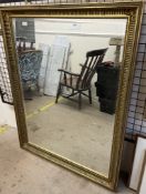 A large gilt decorated wall mirror,